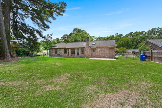 8116 Long Shadow Ln, North Charleston, SC 29406 - rear view of house featuring a patio area, brick siding, a fenced backyard, and a chimney