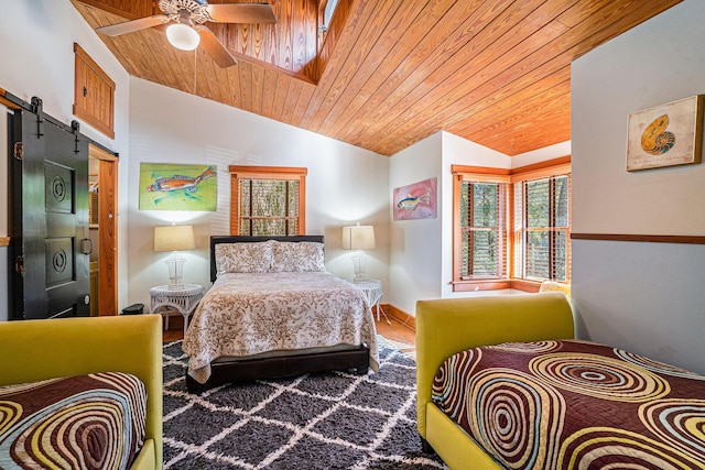 520 E Huron Ave, Folly Beach, SC 29439 - bedroom with a barn door, lofted ceiling, wood ceiling, carpet, and ceiling fan