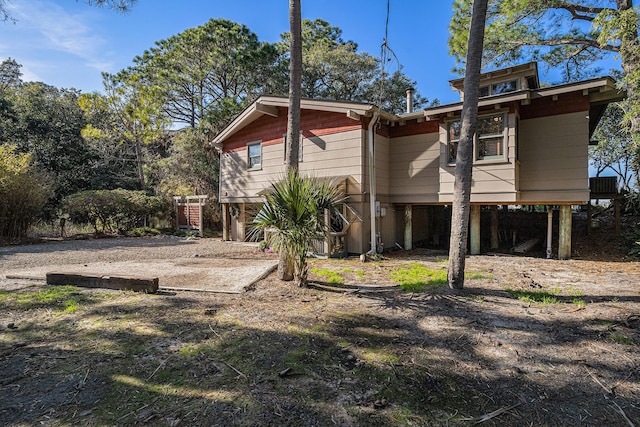 520 E Huron Ave, Folly Beach, SC 29439 - rear view of property featuring a carport