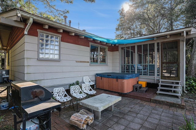 520 E Huron Ave, Folly Beach, SC 29439 - view of patio with a hot tub and a sunroom