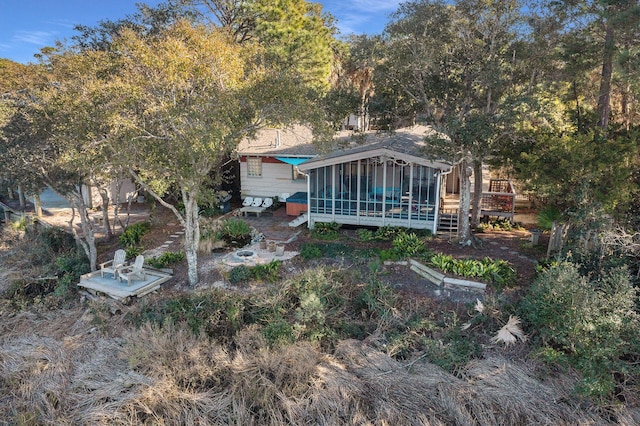 520 E Huron Ave, Folly Beach, SC 29439 - rear view of property with a deck and a sunroom