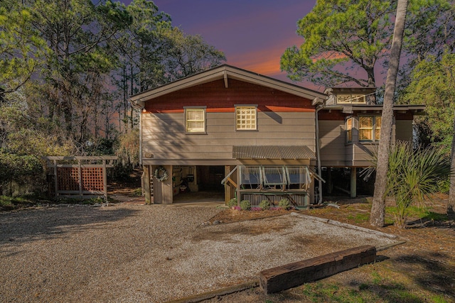 520 E Huron Ave, Folly Beach, SC 29439 - view of front of house featuring a carport and dirt driveway