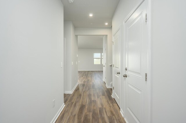 corridor featuring dark hardwood / wood-style floors