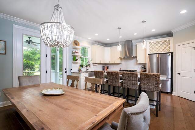 1976 Liberia Rd, Wadmalaw Island, SC 29487 - dining area featuring plenty of natural light, ornamental molding, wood-type flooring, a chandelier, and recessed lighting