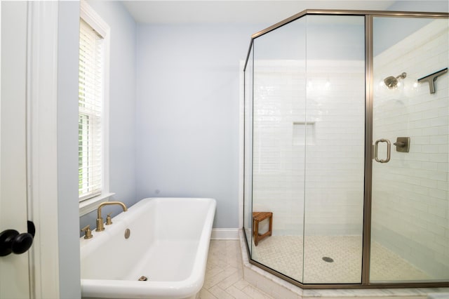 1976 Liberia Rd, Wadmalaw Island, SC 29487 - full bathroom featuring a freestanding bath, a stall shower, and baseboards