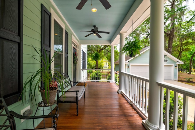 1976 Liberia Rd, Wadmalaw Island, SC 29487 - wooden terrace featuring a porch, ceiling fan, and a garage