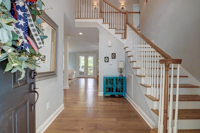 1976 Liberia Rd, Wadmalaw Island, SC 29487 - foyer entrance with stairway, hardwood / wood-style flooring, a high ceiling, baseboards, and recessed lighting