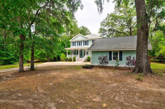 1976 Liberia Rd, Wadmalaw Island, SC 29487 - view of front of property with a shingled roof and covered porch