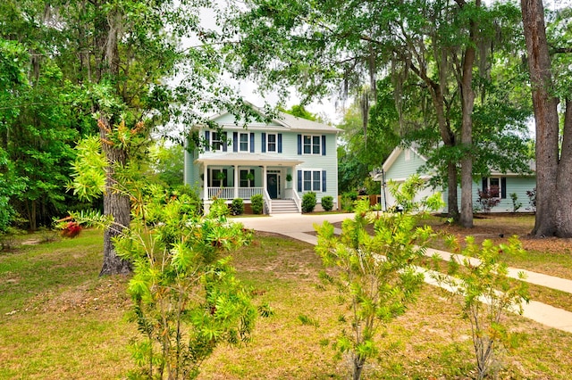 1976 Liberia Rd, Wadmalaw Island, SC 29487 - colonial home with covered porch and concrete driveway