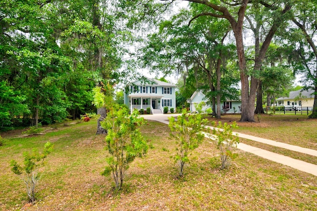 1976 Liberia Rd, Wadmalaw Island, SC 29487 - colonial-style house featuring driveway and a porch