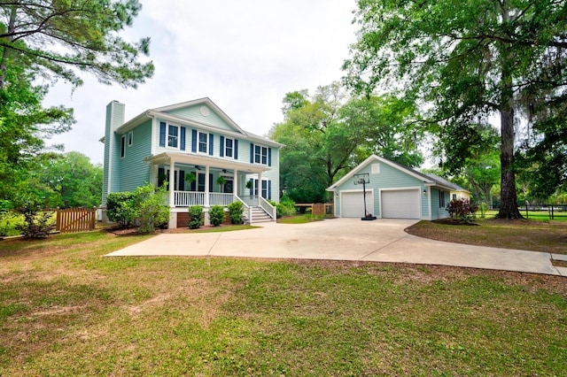 1976 Liberia Rd, Wadmalaw Island, SC 29487 - view of front of home featuring covered porch, a chimney, a detached garage, an outdoor structure, and a ceiling fan