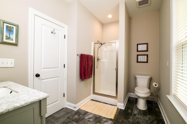 1976 Liberia Rd, Wadmalaw Island, SC 29487 - full bath featuring a stall shower, baseboards, vanity, and toilet