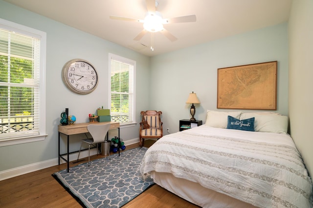 1976 Liberia Rd, Wadmalaw Island, SC 29487 - bedroom featuring baseboards, wood finished floors, and a ceiling fan