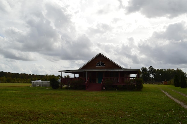 exterior space featuring a porch and a front lawn