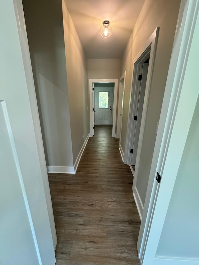 hall with dark hardwood / wood-style floors