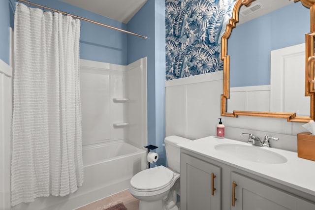 bathroom with visible vents, toilet, wainscoting, vanity, and shower / bathtub combination with curtain