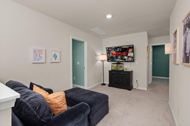 living room featuring carpet flooring and baseboards