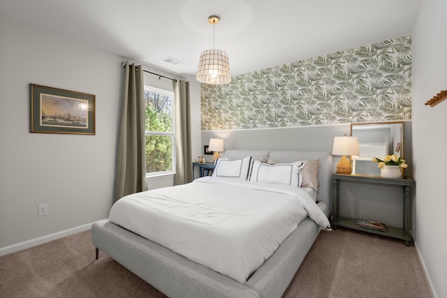 bedroom featuring carpet flooring, wallpapered walls, baseboards, and visible vents