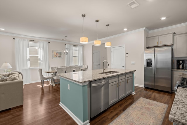 kitchen with dark wood-style floors, gray cabinetry, stainless steel appliances, and a sink