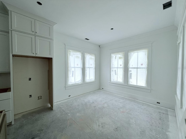 unfurnished bedroom featuring crown molding