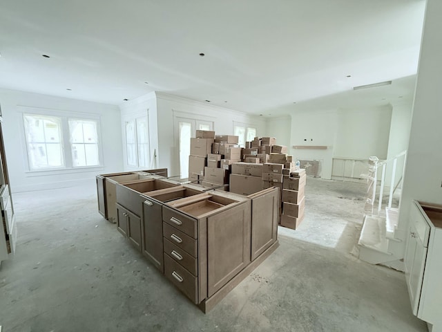 kitchen with dark brown cabinets and a center island