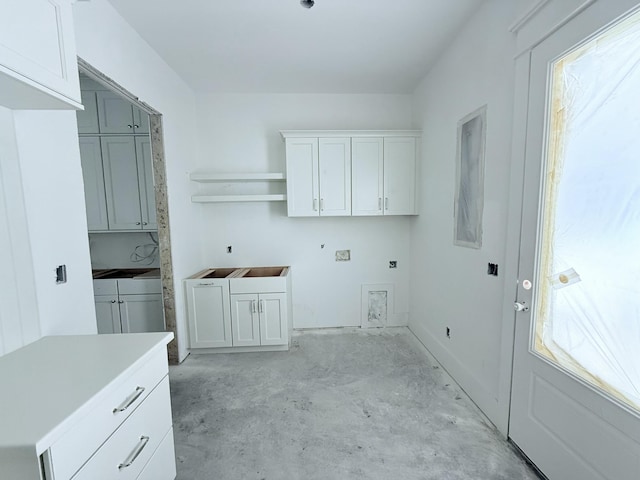 washroom with cabinets and plenty of natural light