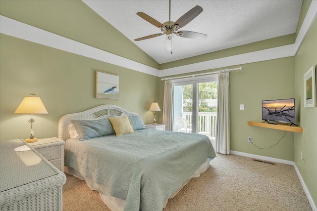 bedroom featuring ceiling fan, lofted ceiling, access to exterior, a textured ceiling, and light carpet