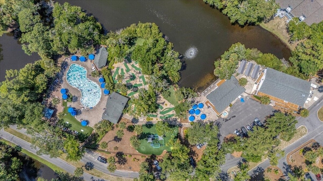 birds eye view of property with a water view