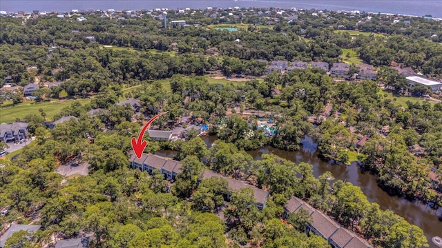 birds eye view of property with a water view