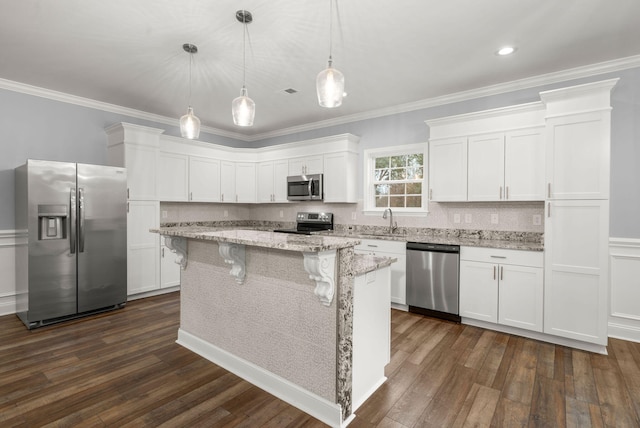 kitchen with appliances with stainless steel finishes, dark wood-style flooring, white cabinetry, and a sink