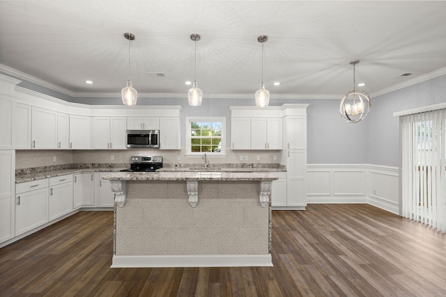 kitchen featuring white cabinetry, appliances with stainless steel finishes, and a sink