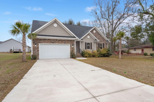 view of front facade featuring an attached garage, concrete driveway, and a front yard