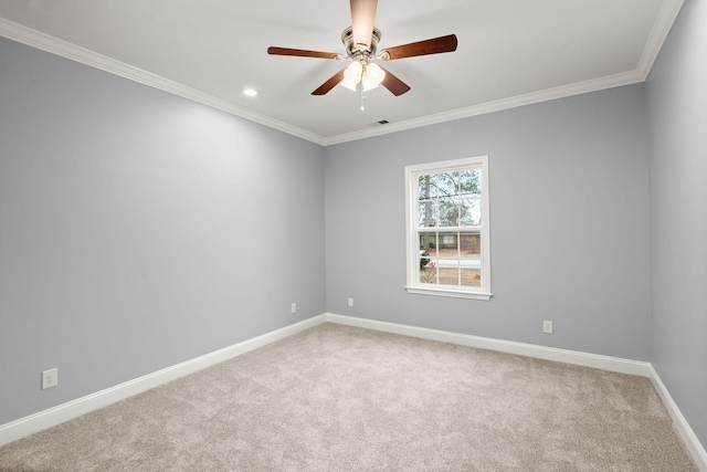 empty room with carpet floors, ornamental molding, baseboards, and ceiling fan