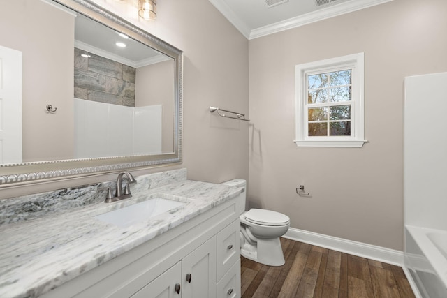 bathroom with toilet, wood finished floors, baseboards, a shower, and crown molding