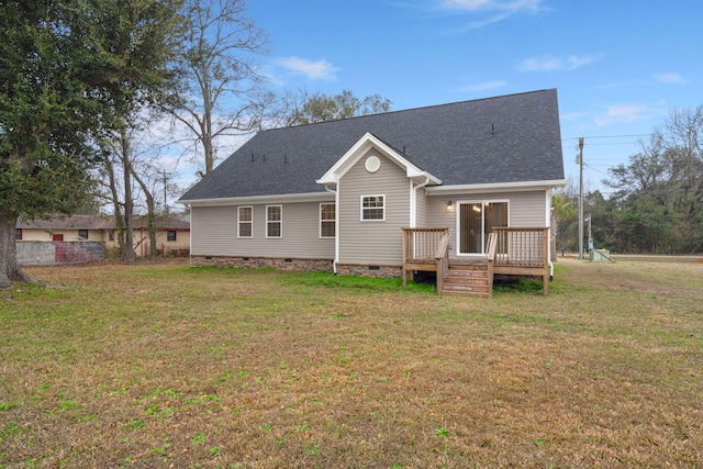 back of house with crawl space, roof with shingles, a lawn, and a wooden deck