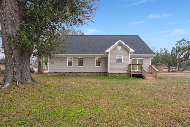 back of house with a deck, a yard, crawl space, and roof with shingles