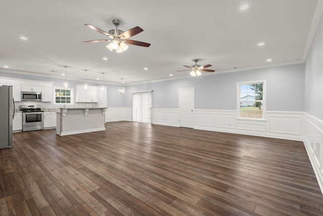 unfurnished living room featuring ornamental molding, recessed lighting, dark wood-style flooring, and ceiling fan