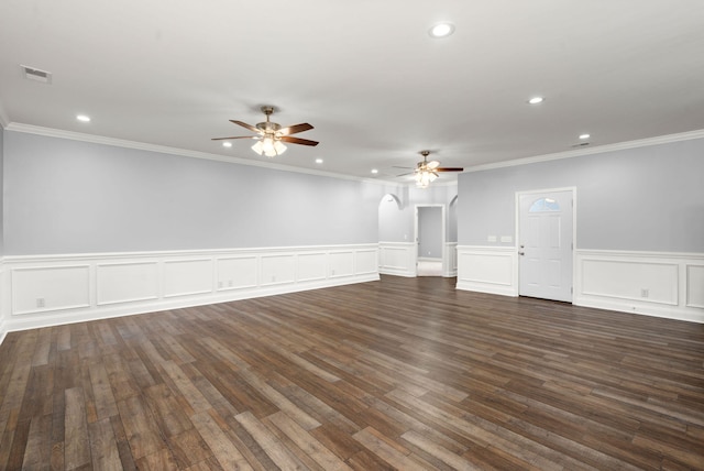 unfurnished room featuring dark wood-style floors, ceiling fan, arched walkways, and recessed lighting