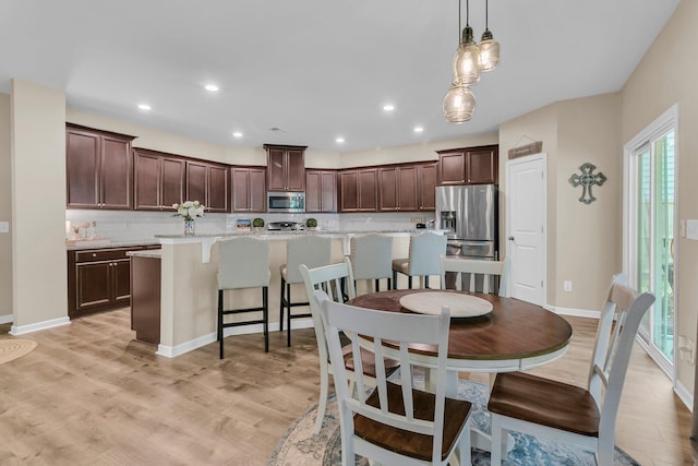 9829 English Elm St, Ladson, SC 29456 - dining space featuring light wood-style floors, baseboards, and recessed lighting