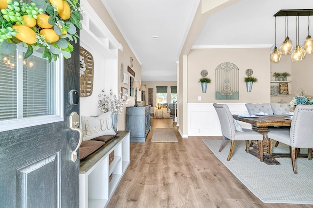 9829 English Elm St, Ladson, SC 29456 - dining room featuring wood finished floors, wainscoting, and crown molding