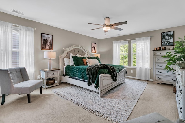 9829 English Elm St, Ladson, SC 29456 - bedroom featuring light carpet, baseboards, and a ceiling fan