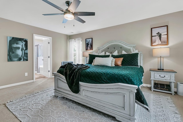 9829 English Elm St, Ladson, SC 29456 - carpeted bedroom with baseboards, ensuite bathroom, and a ceiling fan