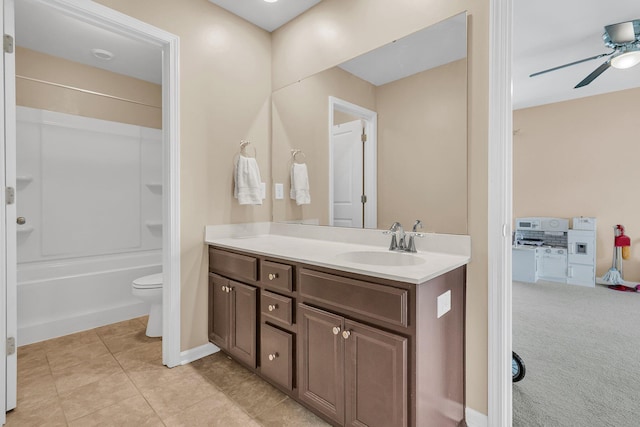 9829 English Elm St, Ladson, SC 29456 - bathroom featuring vanity, toilet, baseboards, and ceiling fan