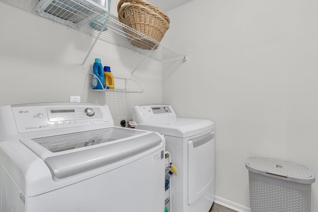 9829 English Elm St, Ladson, SC 29456 - laundry area with washing machine and dryer and baseboards