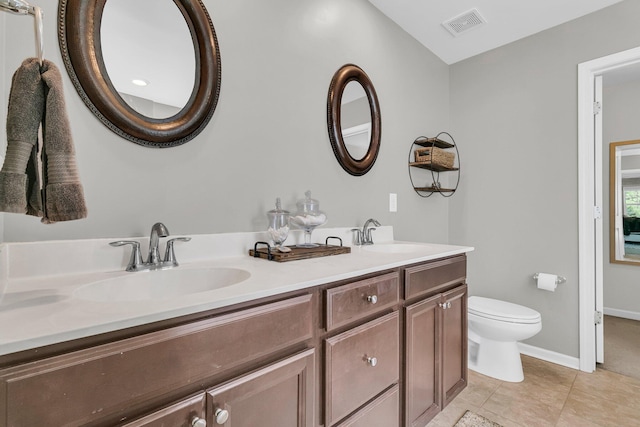 9829 English Elm St, Ladson, SC 29456 - bathroom with double vanity, toilet, tile patterned floors, and baseboards