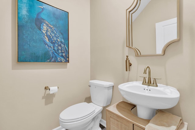 9829 English Elm St, Ladson, SC 29456 - bathroom featuring toilet, baseboards, and a sink