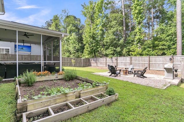 9829 English Elm St, Ladson, SC 29456 - view of yard featuring a garden, an outdoor fire pit, a sunroom, and a ceiling fan