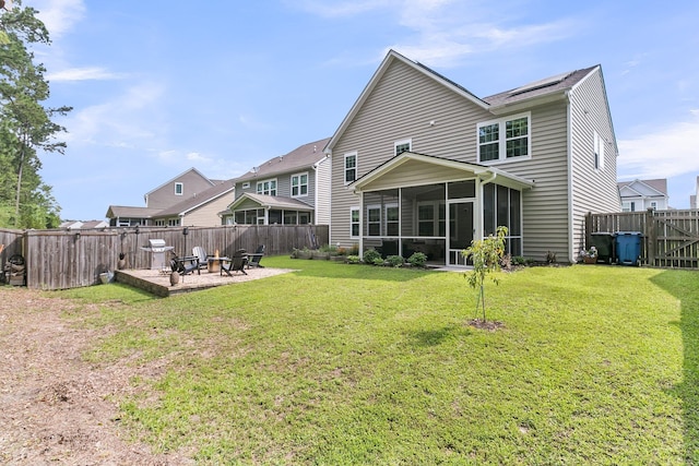 9829 English Elm St, Ladson, SC 29456 - back of property with an outdoor fire pit, a sunroom, and a patio