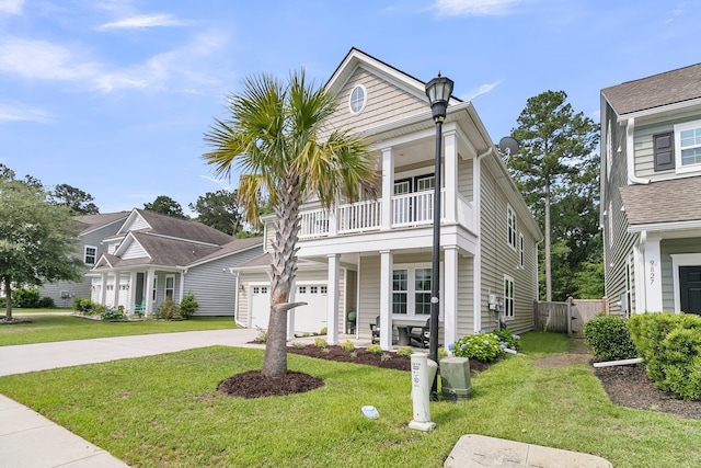 9829 English Elm St, Ladson, SC 29456 - view of front facade with a balcony, concrete driveway, a gate, and a garage