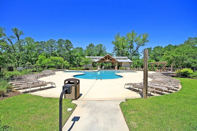 9829 English Elm St, Ladson, SC 29456 - community pool with a patio, a pergola, and view of scattered trees